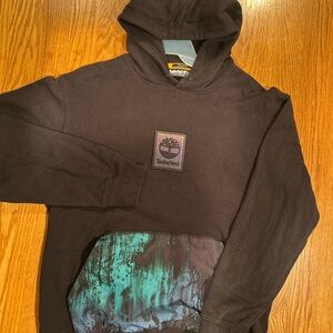 Timberland Black Hoodie with Artistic Green Pocket